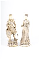 Lot 116 - A pair of German silver and ivory figures,...