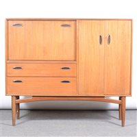 Lot 448 - A teak side cabinet, by G-Plan, with...