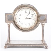 Lot 388 - An Edwardian electroplated mantel clock,...