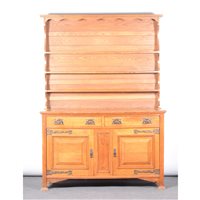 Lot 406 - An English Arts & Crafts oak dresser, the...