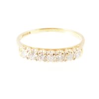 Lot 235 - A diamond half eternity ring, seven brilliant...