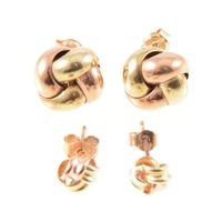 Lot 282 - Two pairs of knot design earstuds, 9 carat...