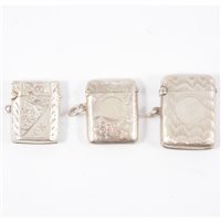 Lot 386 - Three silver vesta match cases,  one engine...