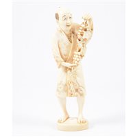 Lot 256 - A Japanese carved ivory okimono of a farmer,...