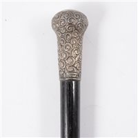 Lot 156 - A silver top ebonised cane, scroll design...