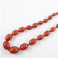 Lot 312 - A string of simulated amber beads, the egg...