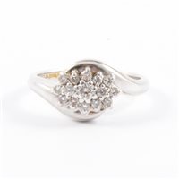 Lot 255 - A boat shape diamond cluster ring, twenty-one...