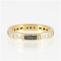 Lot 232 - A sapphire and diamond full eternity ring,...