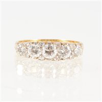 Lot 254 - A diamond five stone half hoop ring, the...