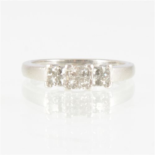 Lot 204 - A Princess cut diamond ring, the twelve...