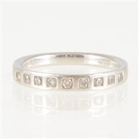 Lot 201 - A diamond half eternity ring, nine brilliant...