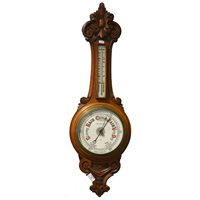 Lot 436 - Edwardian carved oak barometer.