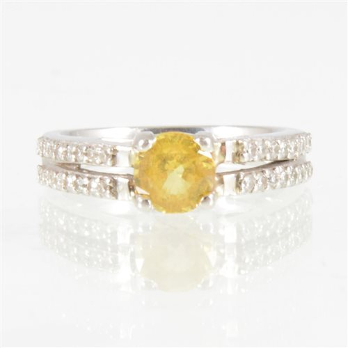 Lot 203 - A yellow sapphire and diamond ring, a 5.8mm...