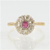 Lot 244 - A ruby and diamond cluster ring, a small round...