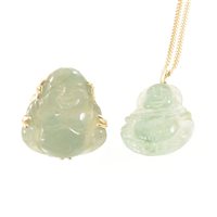 Lot 267 - A matching jade pendant and ring, both in the...