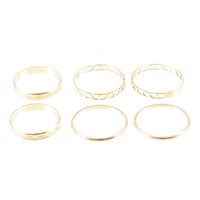 Lot 230 - Seven yellow metal rings, narrow bands, one a...