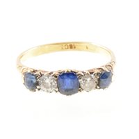 Lot 264 - A sapphire and diamond five stone ring, three...