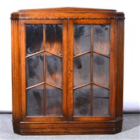 Lot 510 - Oak open bookcase, two glazed panel doors,...