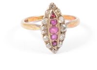 Lot 245 - A ruby and diamond marquise cluster ring, five...