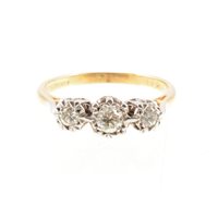 Lot 200 - A diamond three stone ring, the brilliant cut...