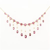 Lot 310 - A garnet fringe necklace, thirteen oval...