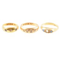 Lot 229 - Three 18 carat yellow gold gemset rings, a...