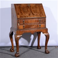 Lot 511 - Reproduction walnut bureau on a stand, ...