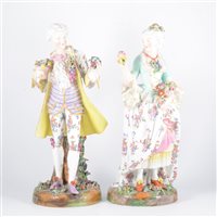 Lot 21 - A pair of German porcelain figures, lady and...