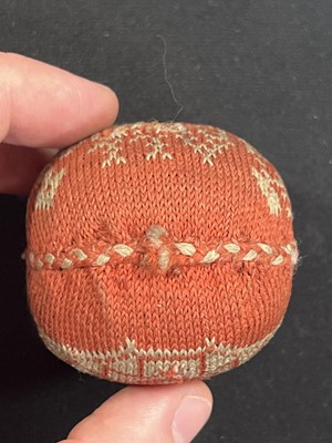Lot 146 - A small needlework pin cushion, and another