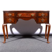 Lot 462 - A walnut bowfront dressing table