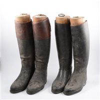 Lot 228 - Two pairs of leather riding boots, both with wooden trees.