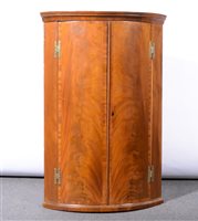 Lot 373 - Georgian mahogany corner cupboard