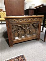 Lot 477 - Gothic style oak blanket box, the panelled lid...