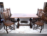 Lot 398 - An oak dining room suite