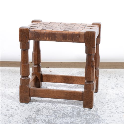 Lot 509 - Robert 'Mouseman' Thompson of Kilburn, an oak stool with woven leather seat.