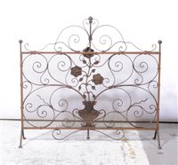 Lot 414 - Wrought iron and mesh fire guard, width 75cm.