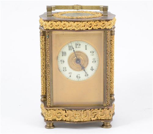 Lot 119 - French brass carriage clock, the case with serpentine outlines.