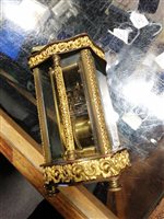 Lot 119 - French brass carriage clock, the case with serpentine outlines.