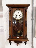 Lot 345 - A beech cased Vienna style wall clock.