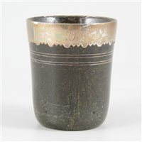 Lot 67 - Turned hardstone beaker, with a white metal rim, probably 18th century.