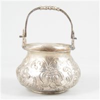 Lot 54 - White metal cauldron-shape bowl with swing handle.