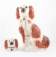Lot 31 - A pair of Staffordshire pottery models, seated King Charles Spaniels