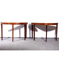 Lot 483 - Pair of George III mahogany demi-lune table ends/console tables, frieze with bobbin moulded outlines, square tapering legs, 122cm.