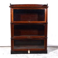 Lot 407 - Stained mahogany three height sectional glazed bookcase.