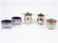 Lot 233 - Pair of George II oval silver salts with blue glass liners by Peter & Anne Bateman London 1791 (3oz); silver jug; white metal bowl set with a sixpence; and a plated mug, (5).