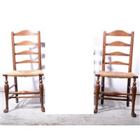 Lot 418 - Pair of North Country fruitwood ladder-back dining chairs.