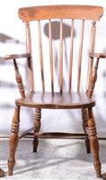 Lot 416 - Beechwood and elm lathe back kitchen chair; and a milking stool (2).