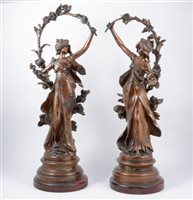 Lot 100 - A pair of patinated spelter sculptures after Auguste Morreau, 'Chrysantheme' and 'Marguerite'