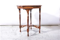 Lot 385 - A walnut octagonal window table, with under-shelf.