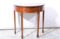 Lot 322 - Mahogany demi-lune table fitted with a single drawer.